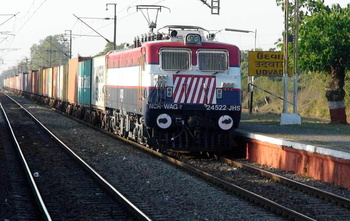 A brand new JHS WAG-7# 24522 in WAP-4 shell lends a touch of colour at Udvada station. (Arzan Kotval)