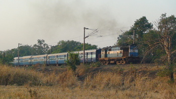 Rajkot Secunderabad Express with a ED WDM3A# 18555 dragging 18coach load & passing through Saphale outer.