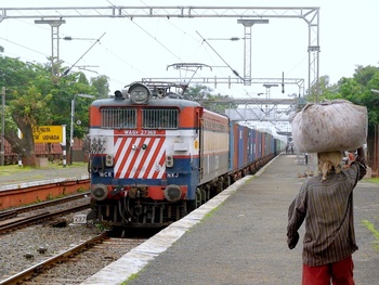 The 2 Load Bearers !The NKJ WAG-7# 27369 and the labourer come face to face at Udvada station. (Arzan Kotval)