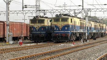 Twin brothers – posing for a photograph !

Triple KYN WCG-2# 20135 bankers of the Cst Chennai Express greet another pair of tr