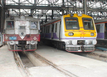 An old Dc emu and an impressive looking Mrvc Emu pose for a shot at Mumbai Central Emu Car shed. (Arzan Kotval)