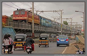 Pune Jaipur SF  with BRC WAP4 22917 at Sangam Bridge