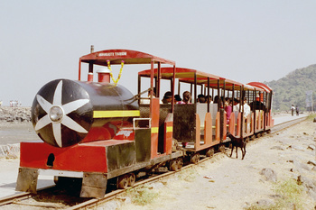Elephanta Mini Train awaits departure from mainland