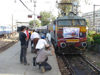 The Mumbai & Pune Gang are seen having a close look of the decorated loco with satisfaction and pride. Venue is Mumbai CST. 