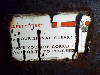 Can you read this warning stitched in cab of YP-2211...? An older version of warning board mounted in cab indicates the stop sig