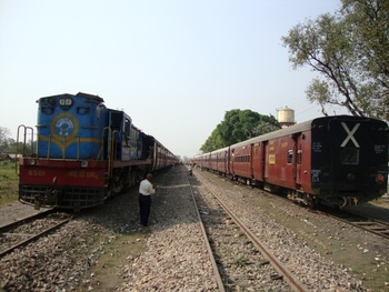 Kapilvastu Express bound for ANDN waits at Naugarh led by IZN YDM-4 # 6581 for crossing with the other train