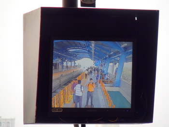 I can be seen in orange shirt in CCTV clicking pics at Chembur. (Arzan Kotval)