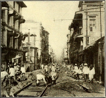 Bombay tramways track laying in a narrow street, 1891